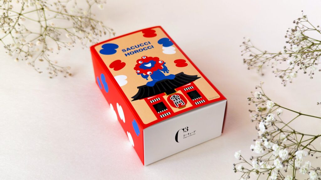 シーキューブ_斜めに置いた「東京出張 ミャクミャク サクッチホロッチ8個入」のパッケージ