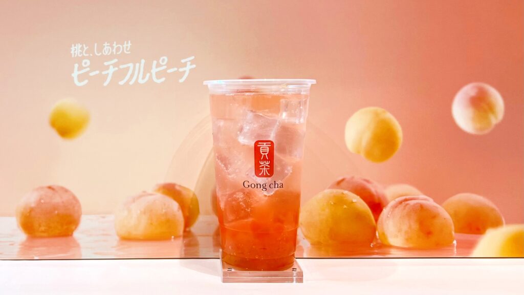 ゴンチャ_カップにはいった「ピーチフルピーチ スパークリングティー」